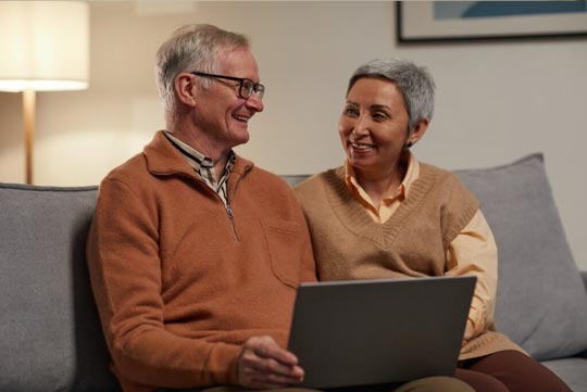 dependent discount dental plan thumbnail - older couple looking for dental care savings on laptop