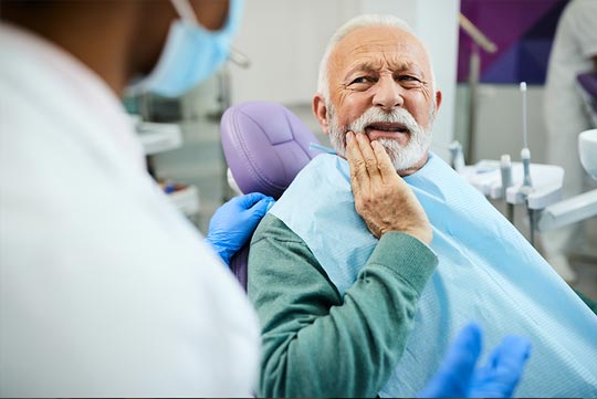 Emergency Dental Plan thumbnail - Patient clenching jaw in pain